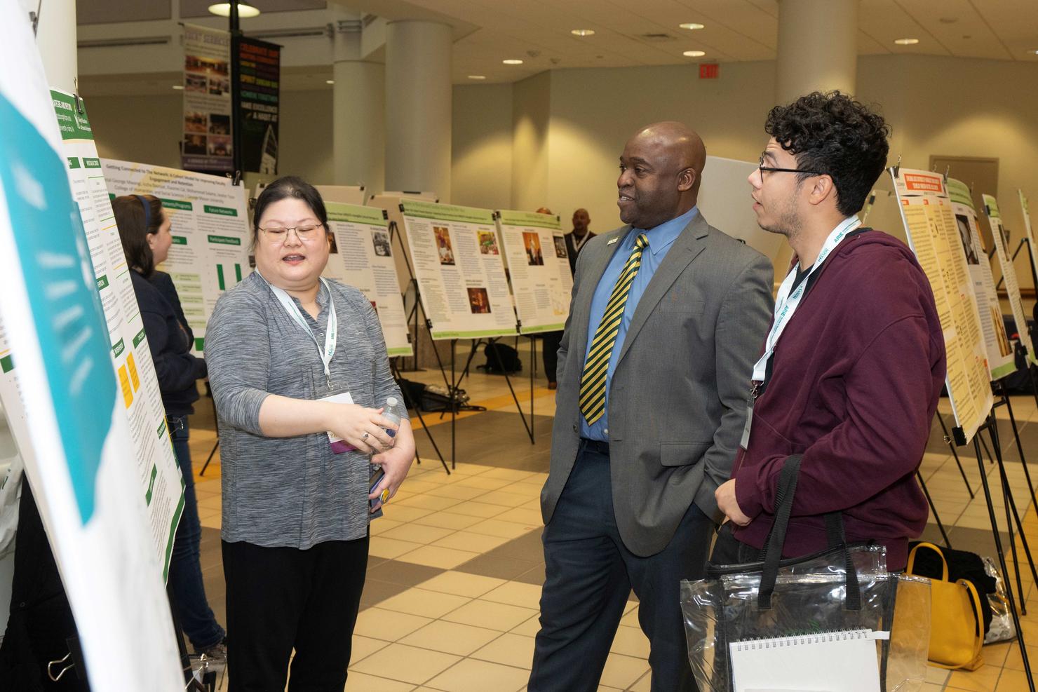 Mason President Gregory Washington visits poster sessions at the ARIE National Conference
